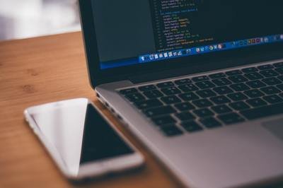 open source ERP - phone and laptop with code
