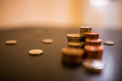 QuickBooks vs ERP - piles of coins